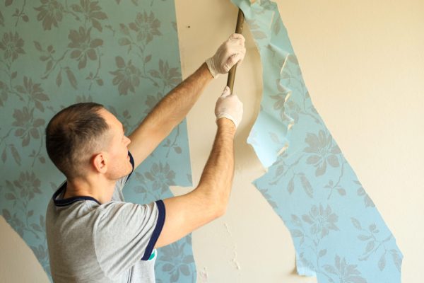a-man-makes-repairs-in-an-apartment-tearing-old-w-2025-01-07-06-15-05-utc